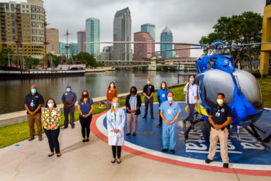 STORY SUMMARY: Group photo for the Tampa General Hospital annual report featuring "unsung heros" of the organization on April 1, 2021.